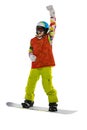 Happy young girl in bright sportswear, goggles and helmet standing with snowboard isolated on white studio background Royalty Free Stock Photo