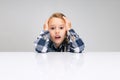 Portrait of beautiful little girl looking suprised, shocked isolated on gray studio background. Human emotions, facial Royalty Free Stock Photo