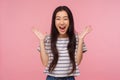 Wow, I won! Portrait of surprised girl with long hair in striped t-shirt screaming in amazement Royalty Free Stock Photo