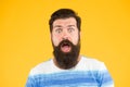 Wow. Real surprise. Man bearded stylish beard yellow background. Barber tips. Beard and mustache. Hipster style. Beard