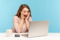 Wow! Surprised happy excited woman looking with amazement into laptop screen, reading shocking news Royalty Free Stock Photo