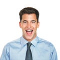 Wow, thats amazing. Studio portrait of a young businessman looking surprised against a white background.