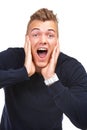 Wow Thats awesome. Studio portrait of an excited young guy yelling in surprise against a white background.