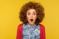 Wow, unbelievable! Closeup portrait of excited amazed woman with fluffy curly hair looking with mouth open