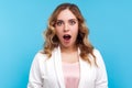 Wow, unbelievable! Portrait of excited woman looking with mouth open in surprise. isolated on blue background
