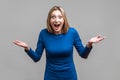 Wow, unbelievable! Portrait of positive astonished woman with widely open mouth and big eyes. isolated on gray background