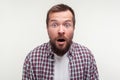 Wow, unbelievable! Portrait of shocked scared bearded man staring at camera with big amazed eyes. white background