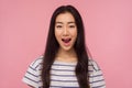 Wow, unbelievable story! Portrait of amazed girl with long brunette hair in striped t-shirt keeping her mouth opened