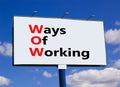 WOW ways of working symbol. Concept words WOW ways of working on white billboard against blue sky and clouds. Beautiful background Royalty Free Stock Photo