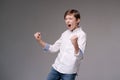 Wow you look advertising here amazed cute teen boy in white shirt pointing Royalty Free Stock Photo