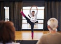 Wowing them with her moves. a female dancer performing before the judges during a dance audition.