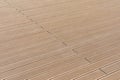 Wood plastic composite decking boards. Decking board, diagonal laying. Building background. Royalty Free Stock Photo