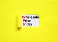 WPI wholesale price index symbol. Concept words WPI wholesale price index on white paper on a beautiful yellow background.