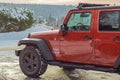 Wrangler sport jeep parking in the winter park in Canada. Close up of a red Jeep in winter day Royalty Free Stock Photo