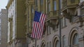 Wrapped around flagpole flag of the USA in Russia Moscow