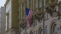 Wrapped around flagpole flag of the USA in Russia Moscow