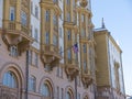 Wrapped around flagpole flag of the USA in Russia Moscow