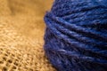 Wrapped blue rope  on natural linen fabric. Macro shooting Royalty Free Stock Photo