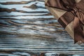 Wrapped brown present box on wooden background