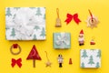 Wrapped christmas gifts and many retro christmas ornaments isolated on bright yellow background. Christmas composition. Royalty Free Stock Photo
