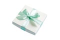 wrapped Christmas or other holiday handmade present in white paper with green ribbon on colored background. Present box Royalty Free Stock Photo