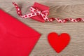 Wrapped gift, red heart and love letter for Valentines Day, copy space for text Royalty Free Stock Photo