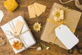 wrapped gift tied with tag string beautiful flower wooden surface. High quality photo