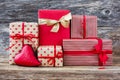 Wrapped gifts and red heart on wooden background. Toned, soft focus, vintage style Royalty Free Stock Photo