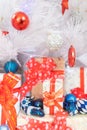 Wrapped gifts under a decorated Christmas tree background. - Shallow of focus Royalty Free Stock Photo