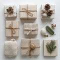 Wrapped holiday gifts arranged in a circular pattern surrounded by pine branches and cones Royalty Free Stock Photo