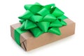 Wrapped kraft paper brown gift box with green ribbon bow, isolated on white Royalty Free Stock Photo