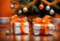 orange christmas gift parcels under a tree decorated with matching baubles