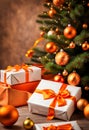 orange christmas gift parcels under a tree decorated with matching baubles