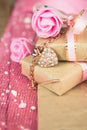 Wrapped in parchment paper, delicate fresh pink flowers with golden heart Royalty Free Stock Photo