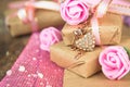 Wrapped in parchment paper, delicate fresh pink flowers with golden heart Royalty Free Stock Photo