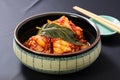 wrapped up bossam kimchi in a ceramic plate