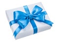 Wrapped white gift box with blue knot isolated on white