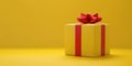 a wrapped yellow gift with a red ribbon on a yellow background