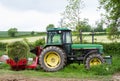 Wrapping a hay bale with plastic wrap