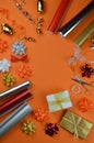 Gift wrapping utensils on orange ground