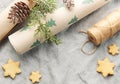 Wrapping paper with a pine branch and Christmas cookies on a textile background Royalty Free Stock Photo