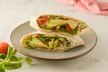 Wraps or torttila. Avocado, vegan wrap sandwiches. Healthy food