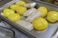 Wraps of White and Yellow Eba -Garri in chaffing dish at party