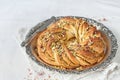 Wreath Bread on a vintage tray with pistachio filling Royalty Free Stock Photo