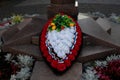 A wreath at the foot of the monument. In memory of the fallen soldiers during the war. Royalty Free Stock Photo