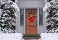 Wreath on front door with elegant wood grain Royalty Free Stock Photo