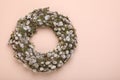 Wreath made of beautiful willow flowers on beige background, top view. Space for text Royalty Free Stock Photo