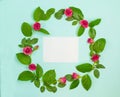 Wreath of roses with leaves and empty space inside on a blue background.Beautiful greeting card Valentine`s day, Wedding Royalty Free Stock Photo