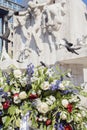 Wreath with white roses near the monument in Amsterdam