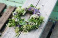 Wreath on wooden background. Slavic divination, tradition Royalty Free Stock Photo